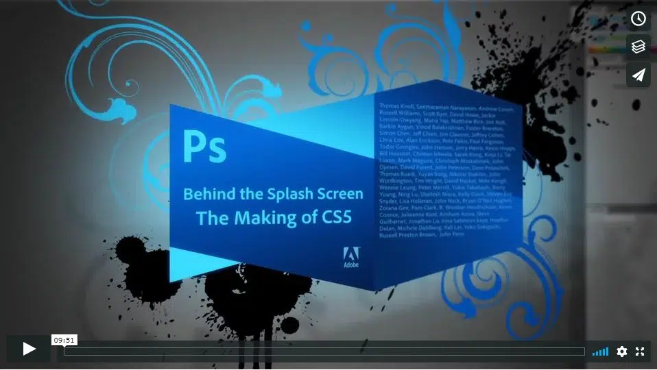 A blue, stylized 3D cube featuring the Adobe Photoshop CS5 logo and the text "Behind the Splash Screen: The Making of CS5" is centered against a background of grey and black ink splatters and blue floral flourishes.