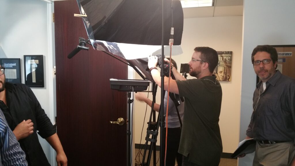 Braun film production crew setting up cameras and lights.